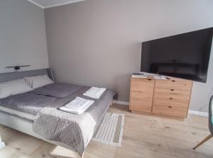 Posteľ alebo postele v izbe v ubytovaní Krosna Street Apartament