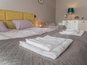 Posteľ alebo postele v izbe v ubytovaní Krosna Street Apartament