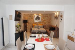a kitchen and living room with a table and a couch at Lovely Nature in Berck-sur-Mer +20 photos
