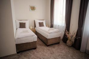Postel nebo postele na pokoji v ubytování BIVIO hotel