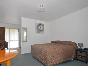 Postel nebo postele na pokoji v ubytování Celtic Motel + 13 fotografií