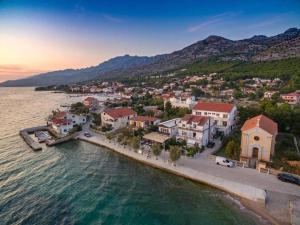 an aerial view of a town next to the water at Apartman Marija in Perušić
