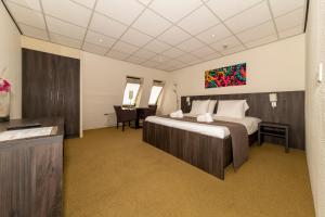 Ένα ή περισσότερα κρεβάτια σε δωμάτιο στο Gasterij De Koekoekshof +45 φωτογραφίες