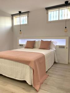 Postel nebo postele na pokoji v ubytování Apartamentos el Oligo