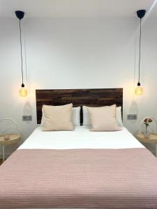 Postel nebo postele na pokoji v ubytování Apartamentos el Oligo + 36 fotografií