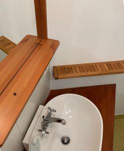 a bathroom with a white toilet and a sink at Fewo Kuller in Lauscha