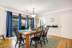 a dining room with a table and chairs at Oceanwoods 452 in Kiawah Island +19 photos