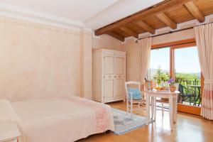 Postel nebo postele na pokoji v ubytování Hotel Sa Muvara