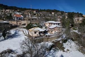 an aerial view of a town in the snow at To Konaki in Synikia Mesi Trikalon