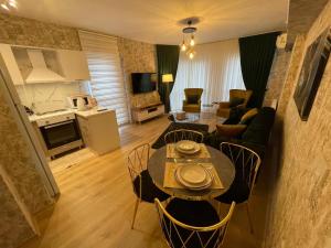 a living room with a couch and a table with chairs at King Suite SS4 in Istanbul