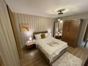 a bedroom with a large bed and a mirror at King Suite SS4 in Istanbul