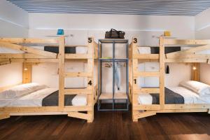 Postel nebo postele na pokoji v ubytování Gabanel Bike Hostel