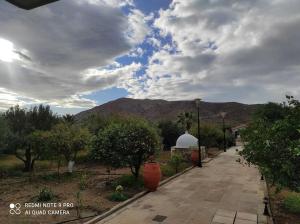 a walkway with a view of a mountain at Diktynna villa in Palekastron