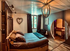 Ein Bett oder Betten in einem Zimmer der Unterkunft Ferme d'Audelange