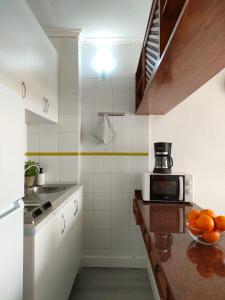 A kitchen or kitchenette at Cozy Beach Holiday Home in Playa del Ingles