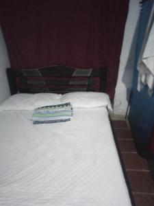 Casa Familiar Fela房間的床