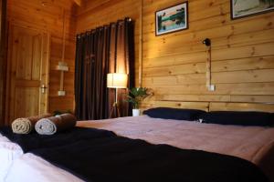 Katil atau katil-katil dalam bilik di Green Chromide's Homestays +21 gambar