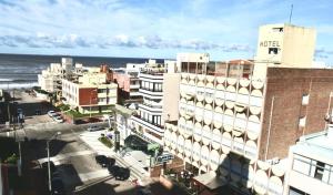 an aerial view of a city with buildings and the ocean at Hotel Alhambra in Punta del Este