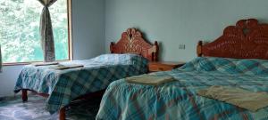 Uma cama ou camas num quarto em Cabaña Sak Ja Selva Lacandona