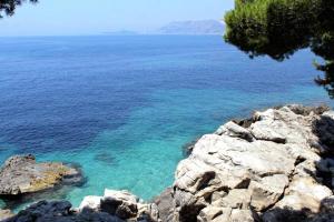 a view of the ocean from a rocky cliff at Apartment Milu - 80m from sea in Cavtat