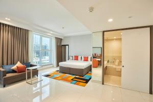 a bedroom with a bed and a living room at Citymax Hotel Business Bay in Dubai