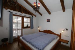 מיטה או מיטות בחדר ב-Holiday home Lieslhütte, Grossarl