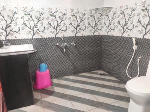 a bathroom with a shower and a sink and a toilet at Spices Garden Homestay & Plantation Tour in Madikeri +20 photos