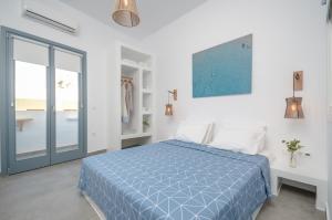 A bed or beds in a room at Aegean Jasmine - In The Center