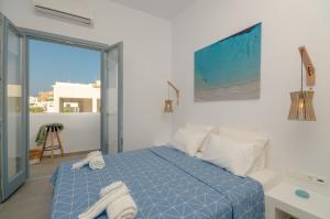 A bed or beds in a room at Aegean Jasmine - In The Center