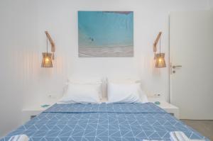 A bed or beds in a room at Aegean Jasmine - In The Center