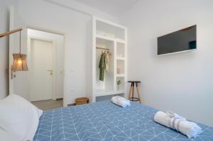 A bed or beds in a room at Aegean Jasmine - In The Center
