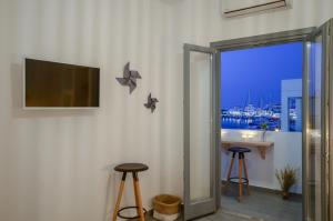 A television and/or entertainment centre at Aegean Jasmine - In The Center