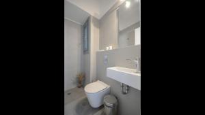 A bathroom at Aegean Jasmine - In The Center