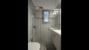A bathroom at Aegean Jasmine - In The Center