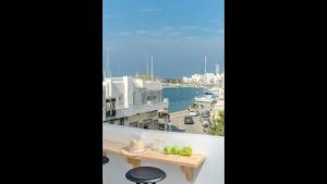 A balcony or terrace at Aegean Jasmine - In The Center