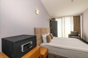 Postel nebo postele na pokoji v ubytování Taksim Hotel V Plus