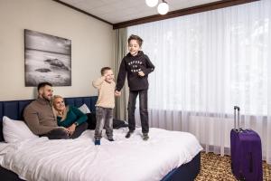 Postel nebo postele na pokoji v ubytování Žilvinas Hotel