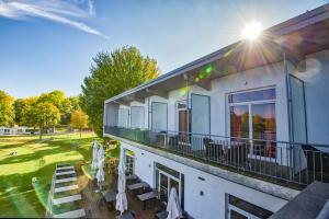 A garden outside Neufeldersee Hotel & Restaurant