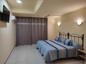 Posteľ alebo postele v izbe v ubytovaní Hotel Novo
