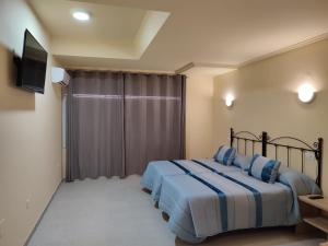 Posteľ alebo postele v izbe v ubytovaní Hotel Novo