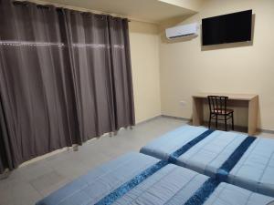 Posteľ alebo postele v izbe v ubytovaní Hotel Novo