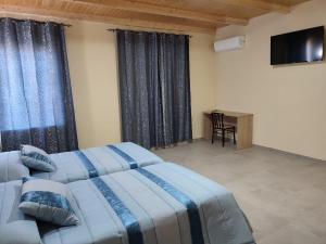 Posteľ alebo postele v izbe v ubytovaní Hotel Novo