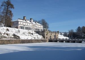 a large building with snow on top of a rink at Am Living Garden in Bad Pyrmont