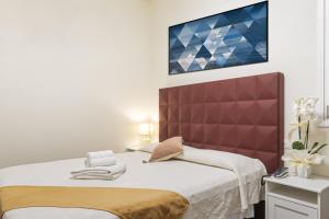 Postel nebo postele na pokoji v ubytování Hotel Villa Pigalle