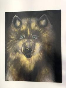 a painting of a brown bear with blue eyes at LOFT Mickiewicza in Toruń