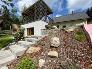 a house with a bunch of rocks in front of it at Almhaus Teichalm/Sommeralm in Breitenau +18 photos