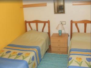 Posteľ alebo postele v izbe v ubytovaní Apartment 350 meters from Playa del Cura