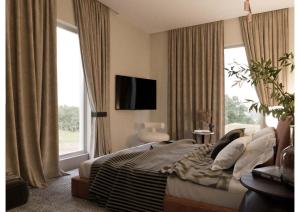 TV a/nebo společenská místnost v ubytování Luxury Villa Inside Resort