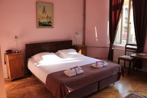 Posteľ alebo postele v izbe v ubytovaní Chopin Boutique