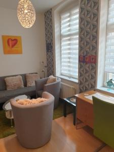 a living room with two chairs and a couch at Ferienwohnung in Halle an der Saale